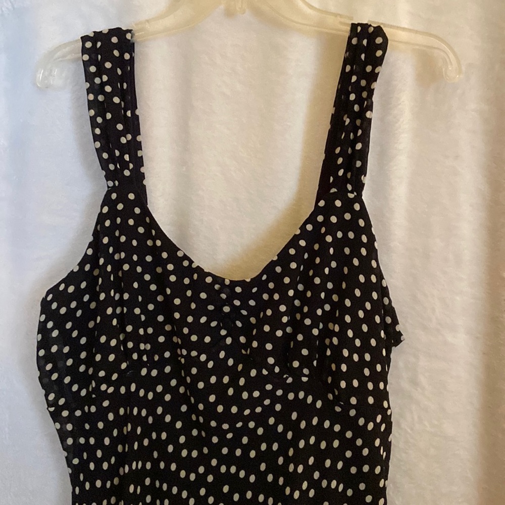 Navy blue sleeveless dress with white polka dots